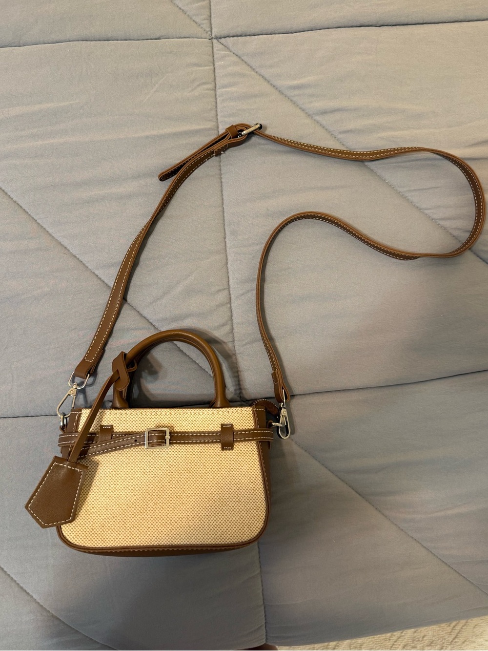 Small brown/beige crossbody tote bag with silver hardware